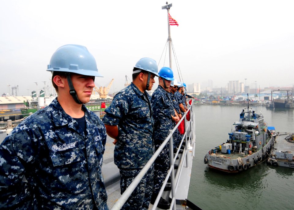 US Navy 111105-N-WJ771-015 Sailors stand by after taking in mooring lines aboard USS Germantown