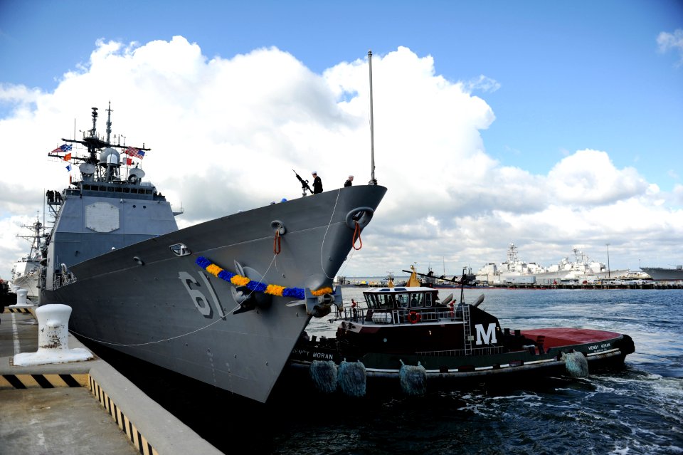 US Navy 111101-N-XR557-045 A tugboat helps the guided-missile cruiser USS Monterey (CG 61) towards the pier as the ship arrives at Naval Station No