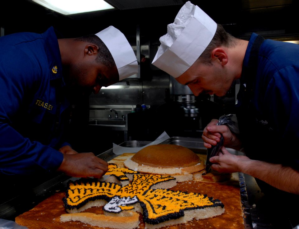 US Navy 111108-N-KA046-010 Sailors decorate a cake for the Marine Corps birthday celebration aboard the amphibious dock landing ship USS Whidbey Is