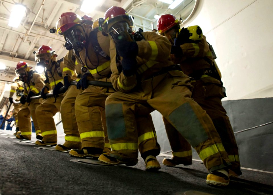 US Navy 111102-N-NR955-027 Members of the repair locker firefighting team aboard USS Iwo Jima work down the ramp into the well deck during a genera