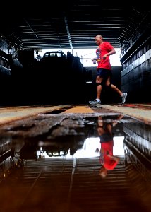 US Navy 111105-N-WJ771-141 Gunnery Sgt. Sammy Supnet runs in the well deck of USS Germantown