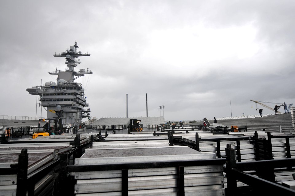 US Navy 111104-N-ZI635-081 Civilian contractors assemble bleachers while constructing a basketball arena aboard Nimitz-class aircraft carrier USS C