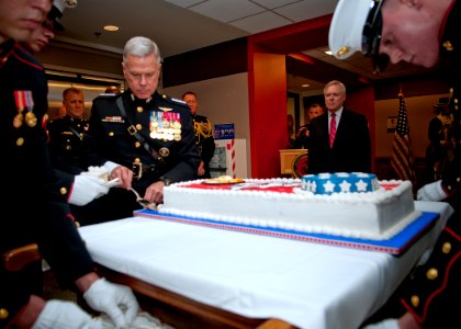 US Navy 111108-N-AC887-002 Secretary of the Navy (SECNAV) the Honorable Ray Mabus watches as Commandant of the Marine Corps Gen. James F. Amos cuts