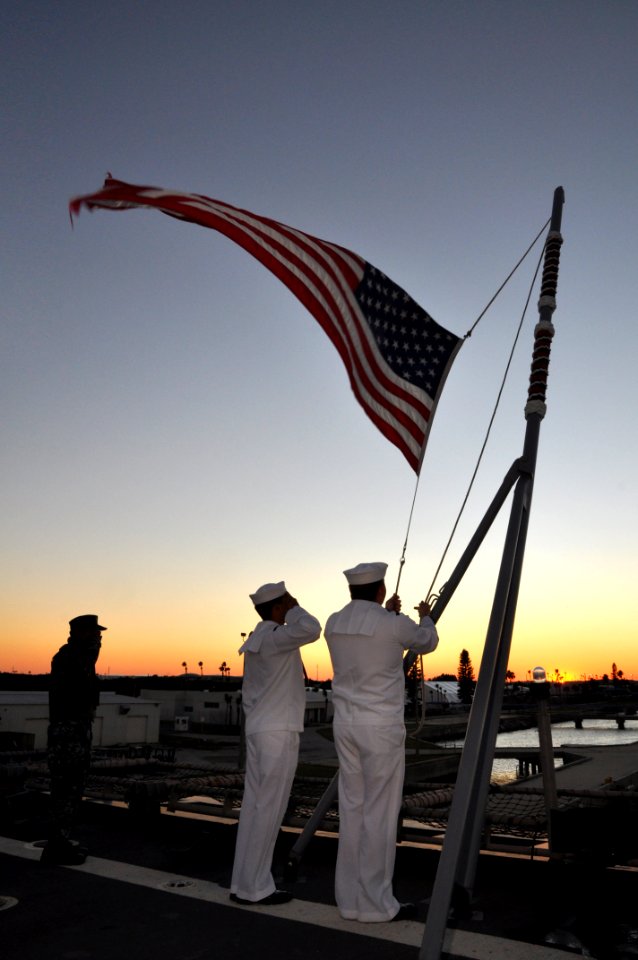 US Navy 111104-N-YX169-262 Aviation Support Equipment Technician 3rd Class Donator Guerrero salutes as Seaman Enzo Triplett and Operations Speciali
