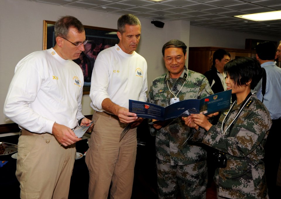US Navy 111108-N-JO245-292 Maj. Gen. Zhou Songhe, Chief of Staff, PLA Forces Hong Kong, and PLA Capt. Guo Binying present Capt. David A. Lausman wi