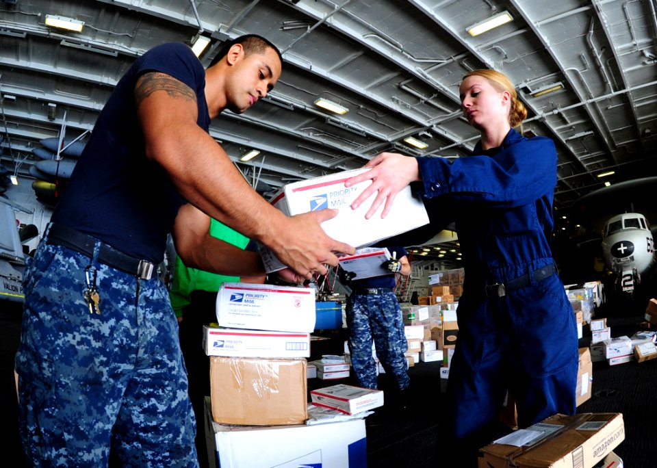 US Navy 111108-N-QL471-074 Aviation Boatwain's Mate (Equipment) Airman Rachel A. Laplant, right, and Electrician's Mate Fireman Martin U. Torres so