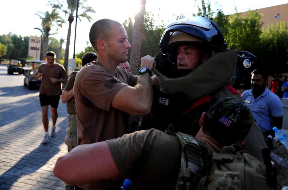 US Navy 111109-N-IR479-160 Senior Chief Explosive Ordnance Disposal Technician Aaron Ryan, assigned to Commander, Task Group (CTG) 56.1, is assiste