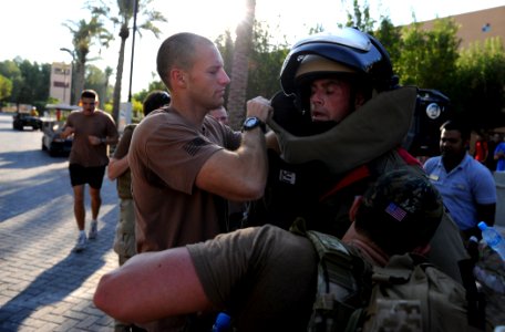 US Navy 111109-N-IR479-160 Senior Chief Explosive Ordnance Disposal Technician Aaron Ryan, assigned to Commander, Task Group (CTG) 56.1, is assiste