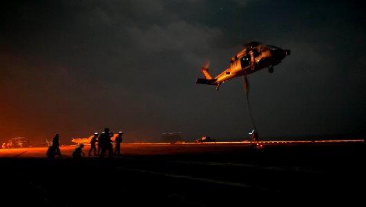 US Navy 111108-N-GC412-226 Sailors fast-rope from an MH-60S Sea Hawk helicopter