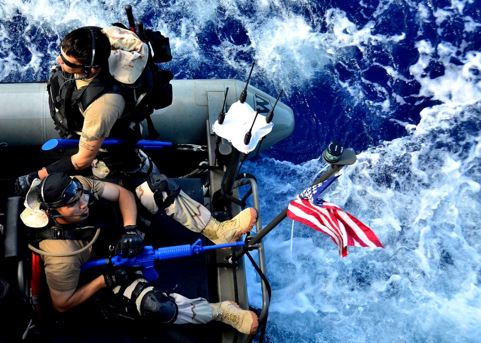 US Navy 111110-N-RI884-047 Members of a visit, board, search and seizure team from the guided-missile destroyer USS O'Kane (DDG 77) ride in a rigi