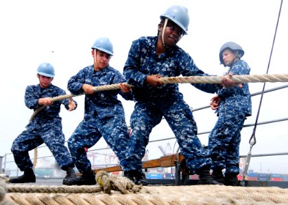 US Navy 111105-N-WJ771-007 Sailors heave around a mooring line on the forecastle of USS Germantown