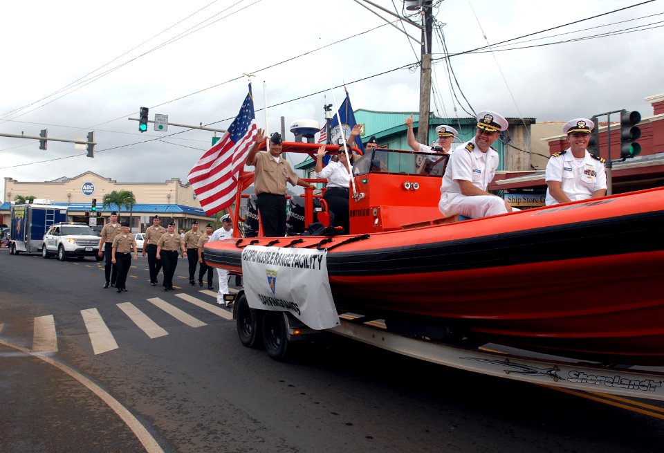 US Navy 111105-N-YU572-108 Sailors from the Pacific Missile Range Facility wave to spectators during the annual Kauai Veterans Day Parade