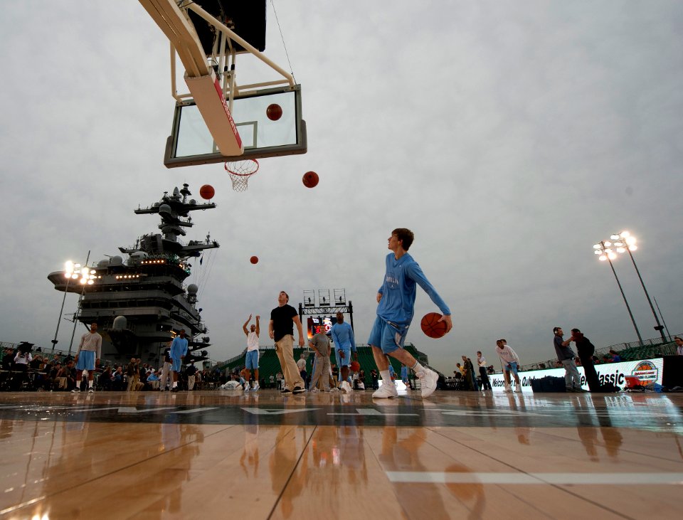 US Navy 111110-N-DR144-363 The University of North Carolina basketball team practices in the basketball arena on the flight deck aboard the Nimitz