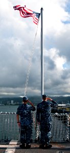 US Navy 111110-N-WX059-006 Sailors aboard the guided-missile destroyer USS Chafee (DDG 90) salute the flag during morning colors before they get un