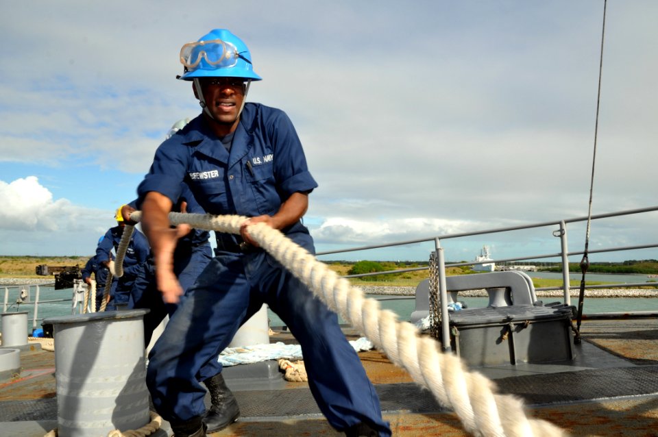 US Navy 111107-N-YX169-176 Seaman Recruit Kristian Brewster heaves a mooring line on the forecastle of the amphibious transport dock ship USS Ponce