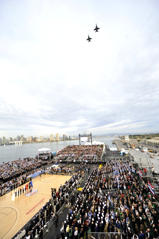 US Navy 111111-N-DR144-286 F-A-18 Hornets perform a fly-by at the conclusion of the presentation of colors during the inaugural Quicken Loans Carri
