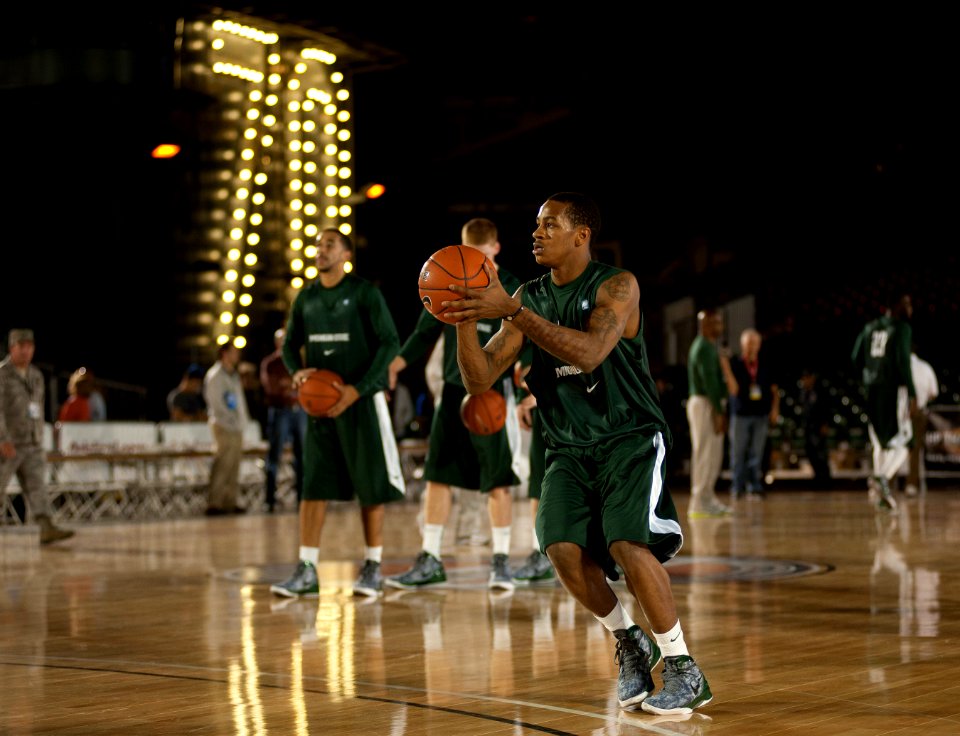 US Navy 111110-N-DR144-894 Michigan State University basketball player Keith Applinging practices in the basketball arena on the flight deck aboard