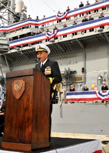 US Navy 111110-N-SG869-168 Rear Adm. Peter A. Gumataotao addresses the audience during a change of command ceremony photo