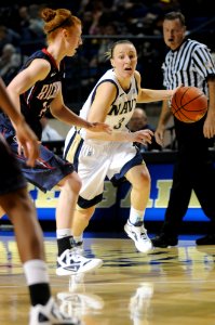 US Navy 111111-N-OA833-004 U.S. Naval Academy guard Erin Edwards (^3) drives to the basket during a women's basketball game at Alumni Hall