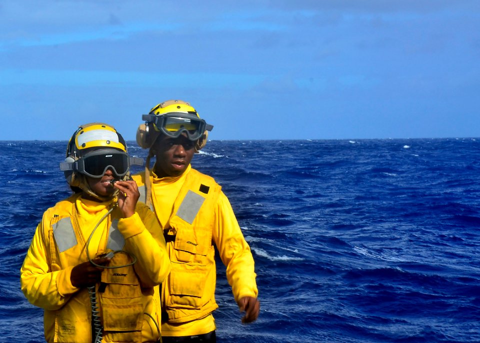 US Navy 111111-N-RI884-104 Sailors aboard the guided-missile destroyer USS O'Kane (DDG 77) prepare for a helicopter landing as part of the integrat