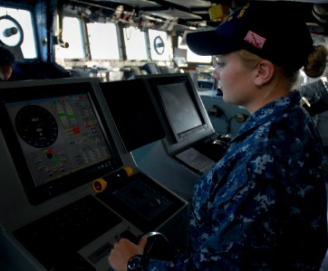 US Navy 111110-N-KA046-061 Seaman Chelsey Demick, from Wyandotte, Mich., mans the helm aboard the amphibious dock landing ship USS Whidbey Island ( photo