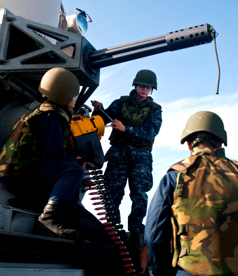US Navy 111111-N-WX059-234 Fire Controlmen 2nd Class Anthony Salcido, left, and Samantha Lowen work on a Phalanx Close-In Weapon System aboard the