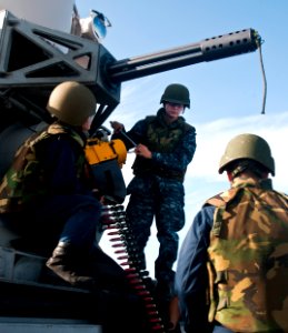 US Navy 111111-N-WX059-234 Fire Controlmen 2nd Class Anthony Salcido, left, and Samantha Lowen work on a Phalanx Close-In Weapon System aboard the