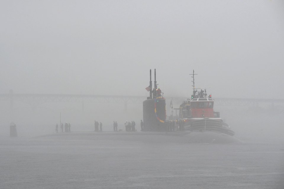 US Navy 111110-N-UM744-001 The Los Angeles attack submarine USS Springfield makes her way through the fog to return to homeport