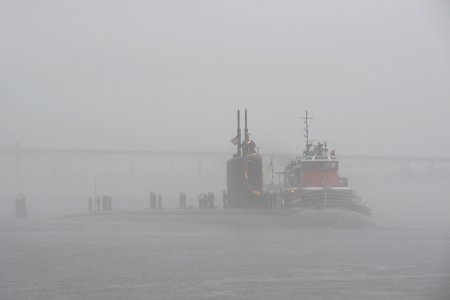 US Navy 111110-N-UM744-001 The Los Angeles attack submarine USS Springfield makes her way through the fog to return to homeport