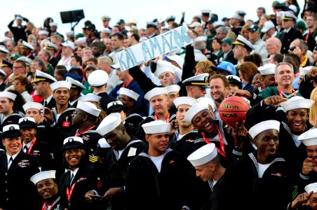 US Navy 111111-N-SB672-327 Sailors assigned to the Nimitz-class aircraft carrier USS Carl Vinson (CVN 70) watch the Quicken Loans Carrier Classic photo