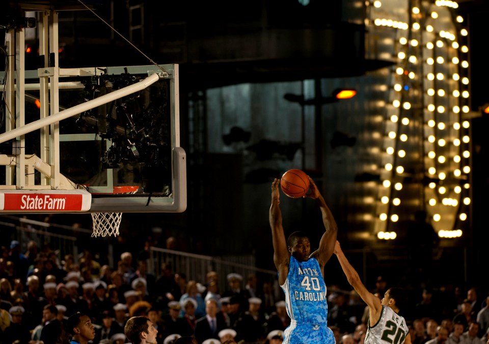 US Navy 111111-N-DR144-973 University of North Carolina's Harrison Barnes guards the ball during the Quicken Loans Carrier Classic