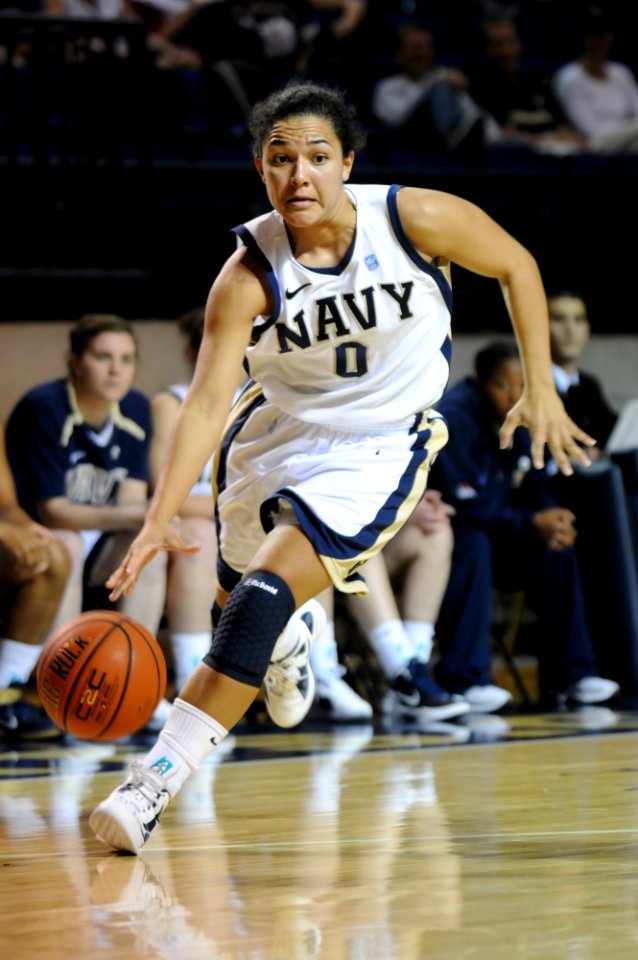 US Navy 111111-N-OA833-003 U.S. Naval Academy guard (^0) Alix Membrenol drives to the basket during a women's basketball game at Alumni Hall