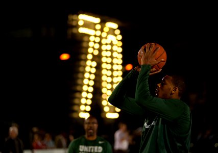 US Navy 111110-N-DR144-782 Michigan State University basketball player Derrick Nix shoots during a practice in the basketball arena on the flight