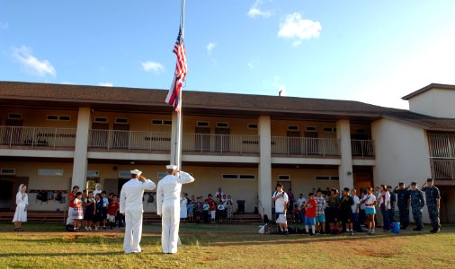 US Navy 111110-N-YU572-076 Sailors from the Pacific Missile Range Facility conduct a flag raising ceremony in observance of Veteran's Day at St. Th photo