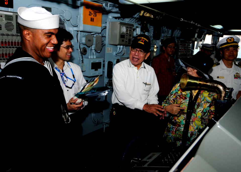 US Navy 111112-N-WJ771-080 Seaman Christopher M. Edmonson describes navigational equipment to members of the Japan Maritime Self-Defense Force on t