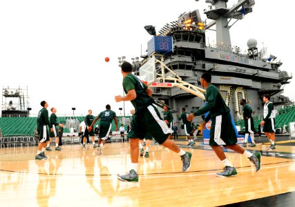 US Navy 111111-N-SB672-005 Michigan State University basketball players practice on the flight deck of the Nimitz-class aircraft carrier USS Carl V