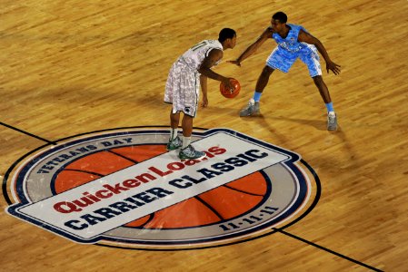 US Navy 111111-N-DR144-139 Michigan State University guard Keith Applinging, left, and North Carolina guard Dexter Strickland square off during the