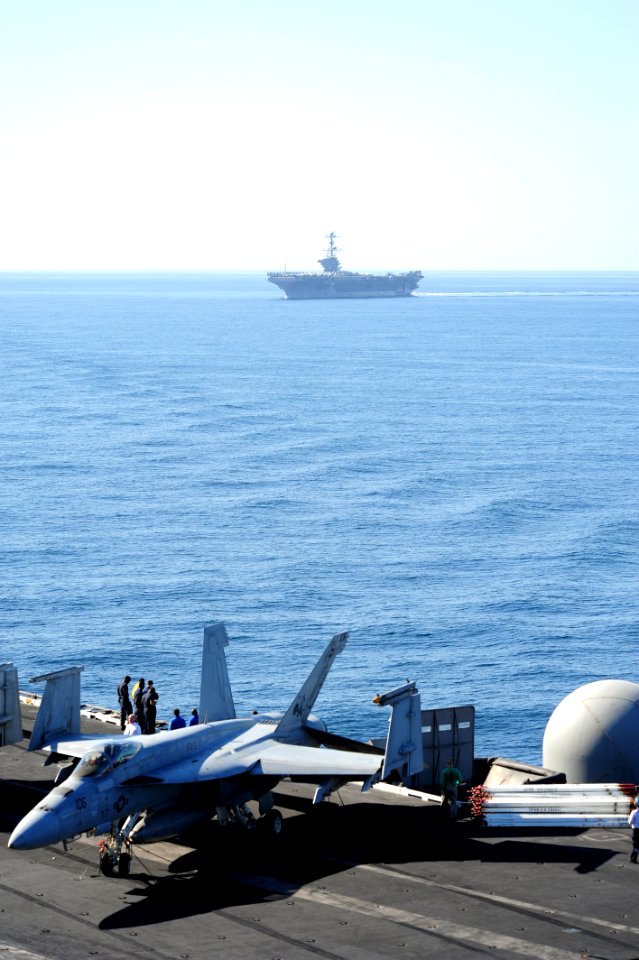 US Navy 111112-N-QL471-089 Two carriers conduct a vertical replenishment