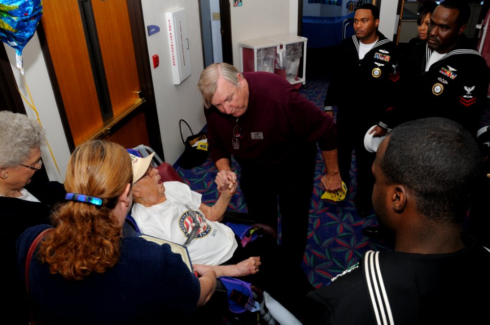 US Navy 111110-N-MZ294-007 Sailors assigned to Navy Recruiting District Saint Louis and Jeff Chapin, a veteran volunteer, talk to Herman Rohrbach,