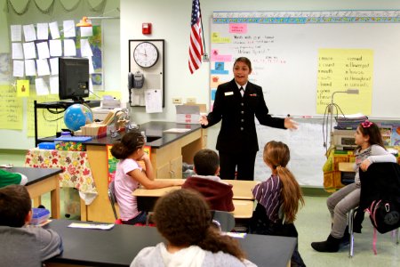 US Navy 111114-N-HN195-902 Fireman Jakquelynn Mejia, assigned to USS Constitution, talks to students at John Hannigan Elementary School in support