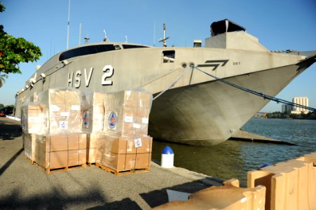 US Navy 111111-N-MN502-014 High Speed Vessel (HSV 2) Swift offlaods 54 pallets of Project Handclasp materials as a part of Southern Partnership Sta