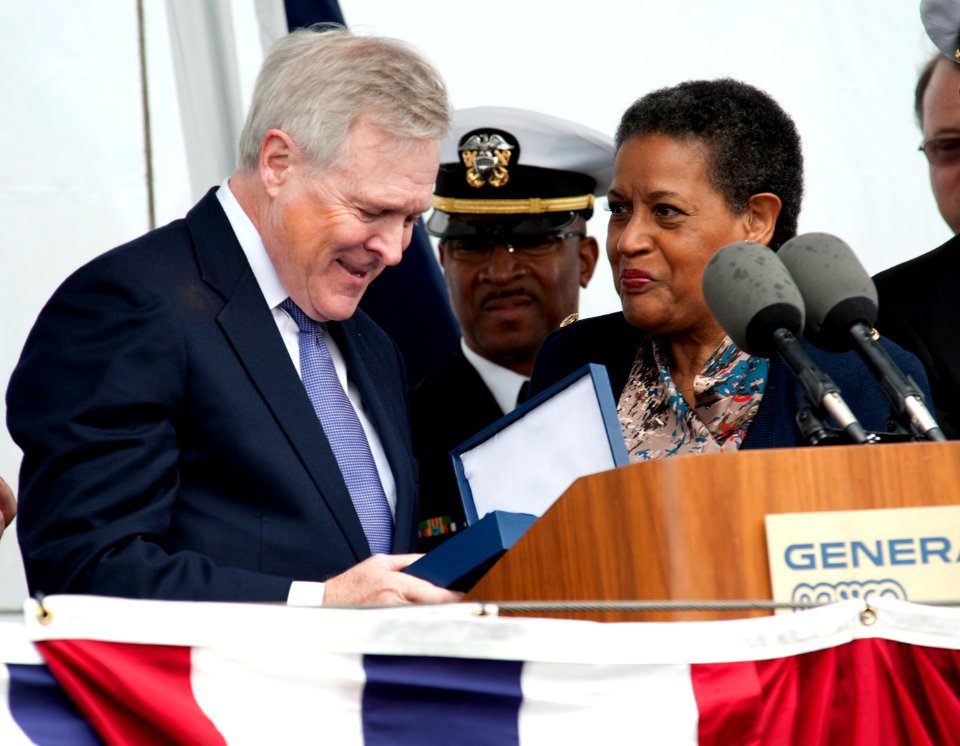 US Navy 111112-N-VY256-257 Secretary of the Navy the Honorable Ray Mabus receives a family heirloom from Myrlie Evers-Williams
