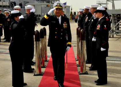 US Navy 111110-N-SG869-002 Rear Adm. Peter A. Gumataotao passes through ceremonial sideboys during a change of command ceremony photo