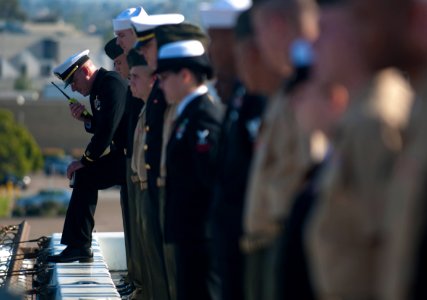 US Navy 111114-N-PB383-249 Chief Warrant Officer Trevor Davis relays information while Sailors and Marines aboard the amphibious transport dock shi