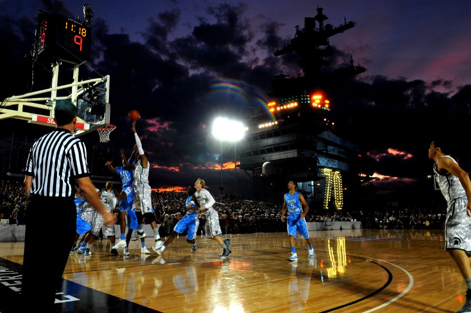US Navy 111111-N-SB672-768 The University of North Carolina and Michigan State University play a basketball game on the flight deck of the Nimitz-c