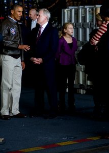 US Navy 111111-N-AC887-004 Secretary of the Navy (SECNAV) the Honorable Ray Mabus welcomes President Barack Obama aboard the Nimitz-class aircraft