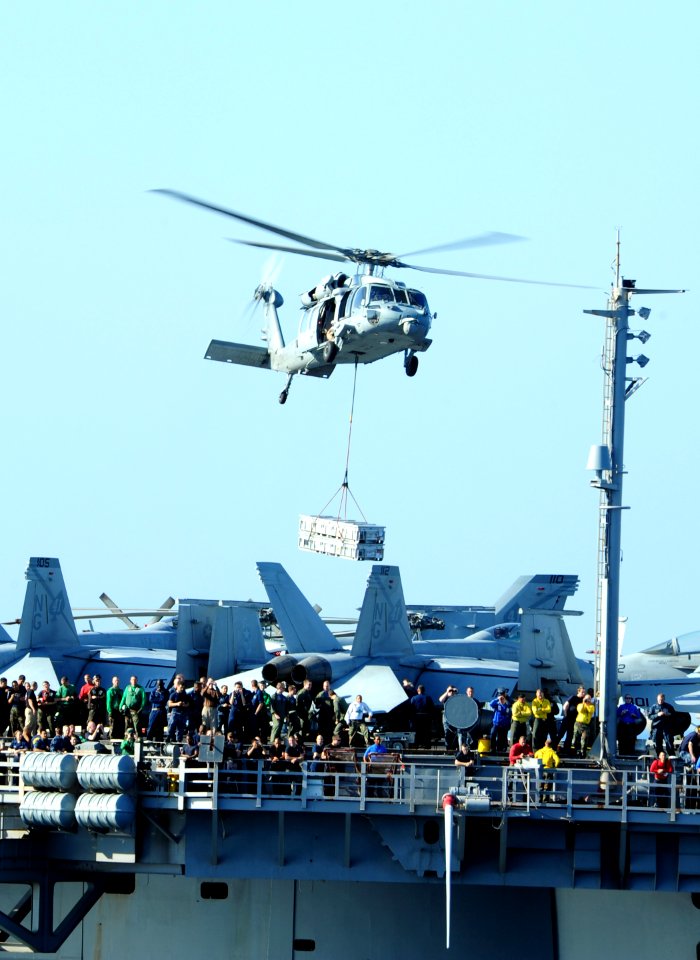 US Navy 111112-N-QL471-332 An MH-60S Sea Hawk conducts a vertical replenishment
