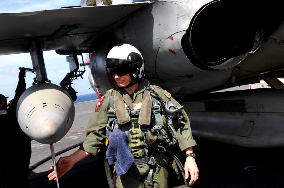 US Navy 111115-N-WW409-100 Rear Adm. J.R. Haley conducts preflight checks on an EA-6B Prowler aboard the Nimitz-class aircraft carrier USS George W