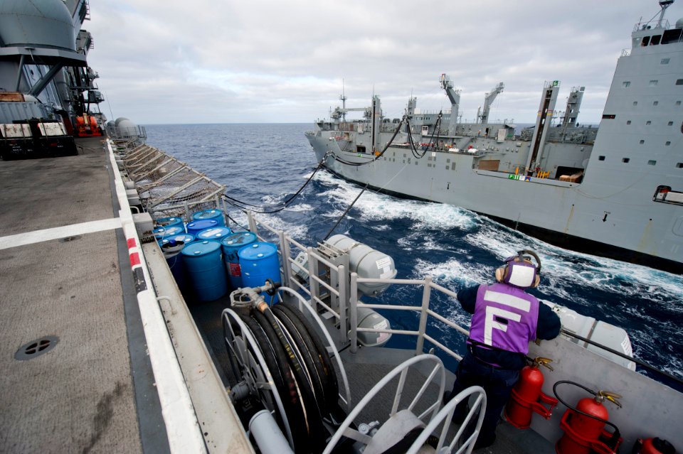 US Navy 111116-N-DX615-014 Aviation Boatswain's Mate (Fuels) Airman Quinton Smith watches a fuel probe from the Military Sealift Command dry cargo