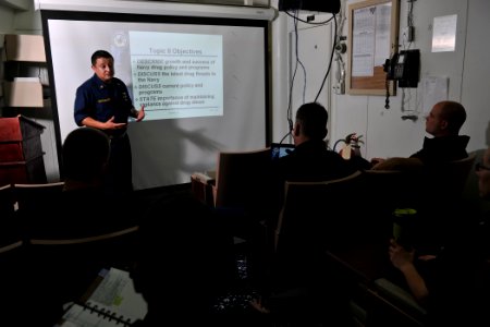 US Navy 111115-N-YZ751-196 Chief Information Systems Technician Alcario Bustamante facilitates an Alcohol and Drug Abuse Management Supervisors cla